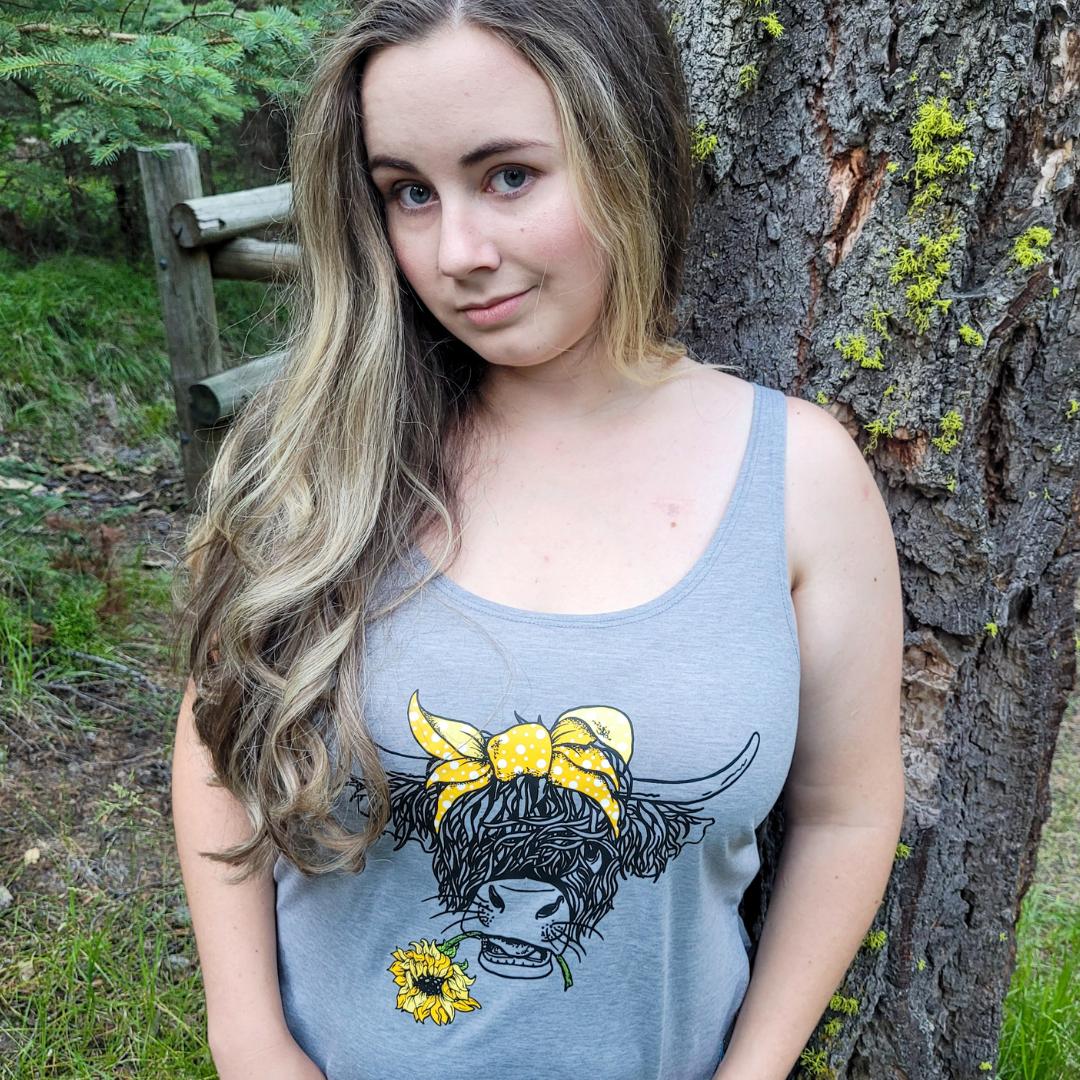 Cowgirl Wearing a Light Grey Highland Cow With Sunflower Western Tank Top 